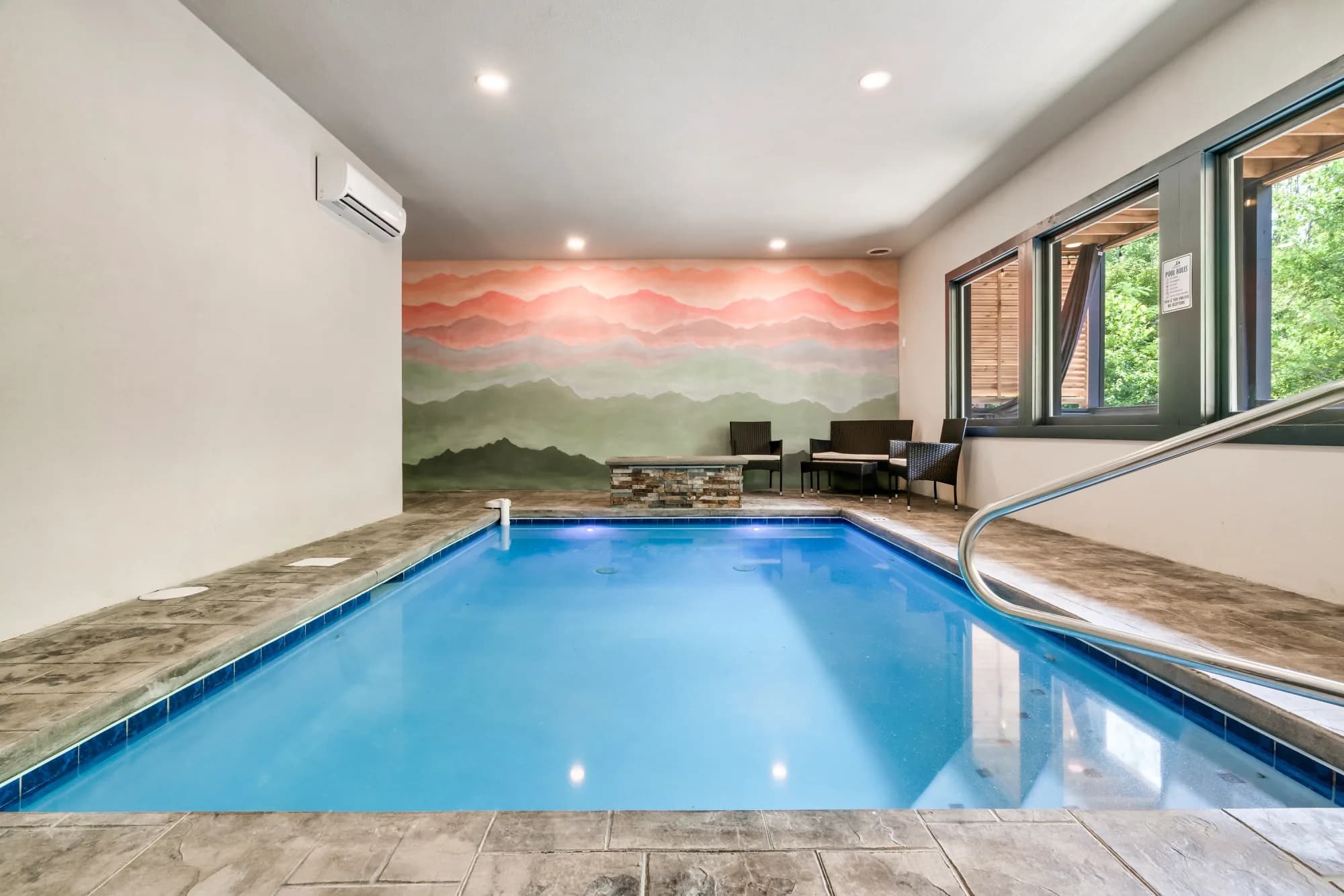 Private Indoor Pool with Mountain Mural